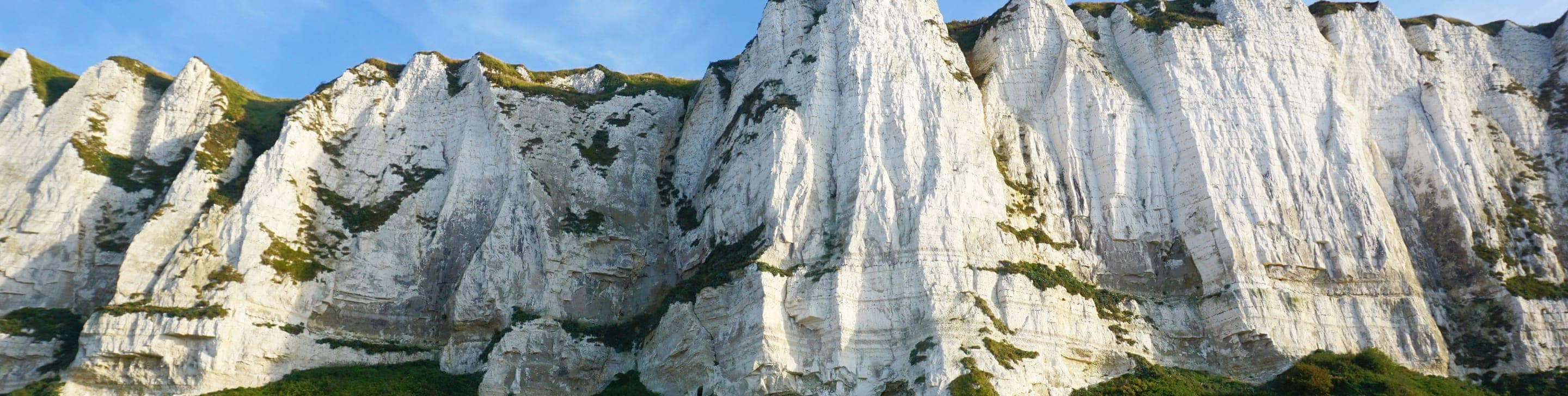 White chalk cliffs above a shingle beach at Dover, England